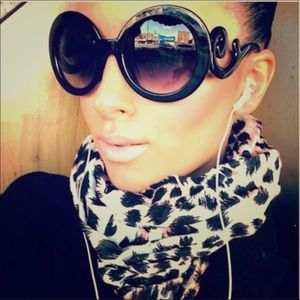 2 sunglasses total 1 black baroque and 1 leopard brown